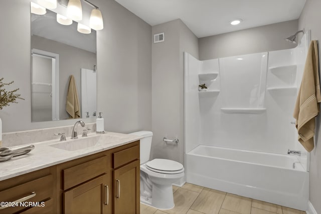 full bathroom featuring vanity, tile patterned flooring, bathtub / shower combination, and toilet