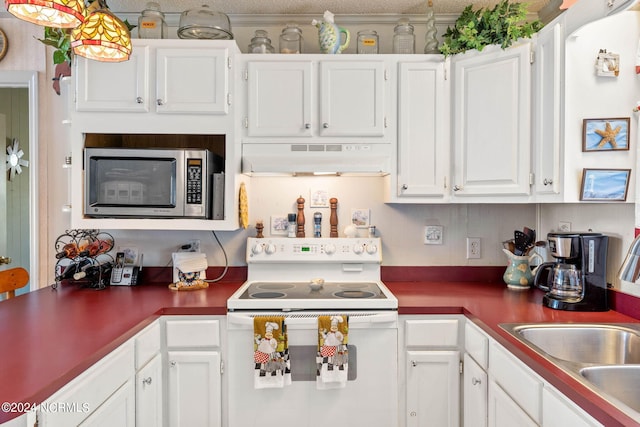 kitchen featuring custom exhaust hood, electric range, and white cabinets