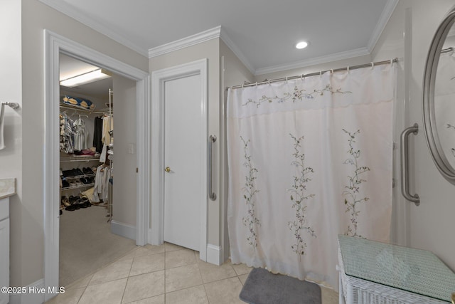 bathroom featuring crown molding, tile patterned floors, and walk in shower