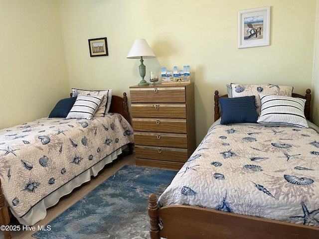 bedroom with wood finished floors