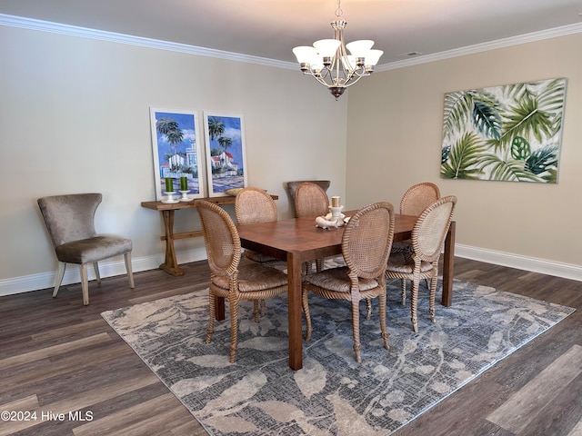 dining room featuring crown molding, dark hardwood / wood-style floors, and a notable chandelier