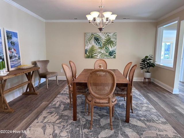 dining room featuring crown molding, dark wood-type flooring, and a notable chandelier