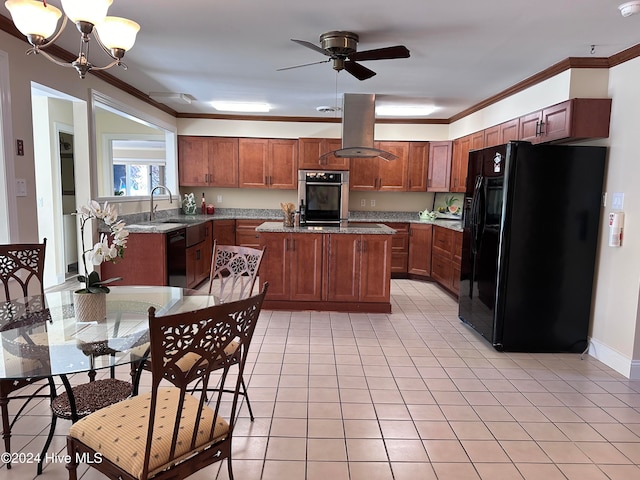 kitchen with light stone counters, island range hood, ornamental molding, black appliances, and a kitchen island