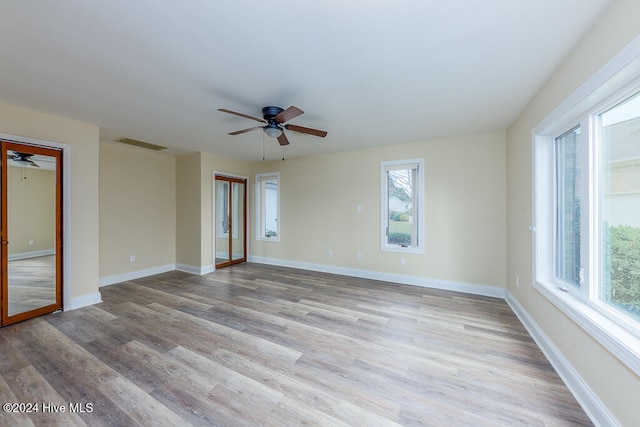 unfurnished room featuring ceiling fan and light hardwood / wood-style flooring