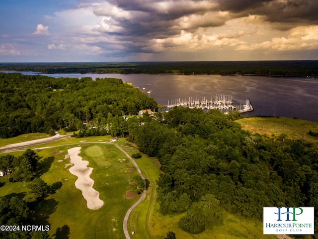 aerial view at dusk featuring a water view