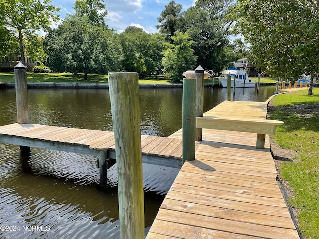 dock area featuring a water view