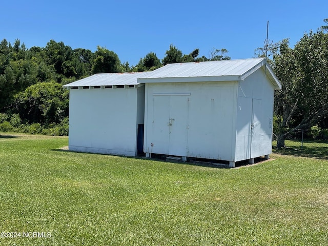 view of shed with fence