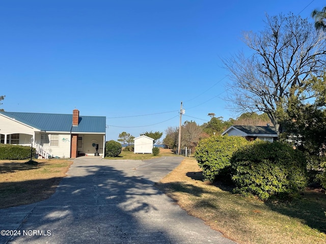 view of road with aphalt driveway