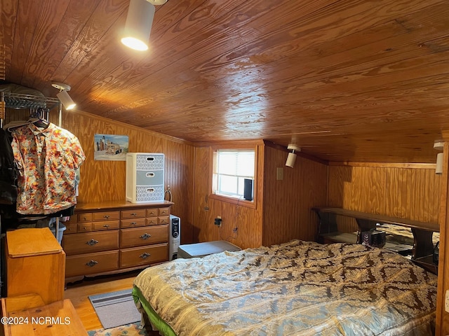 bedroom with wooden ceiling and wood walls