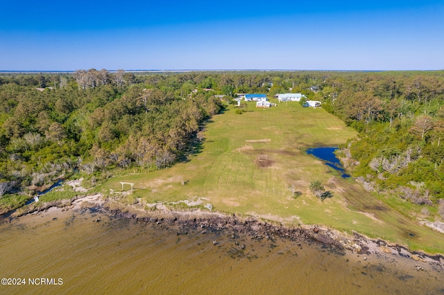 birds eye view of property with a view of trees