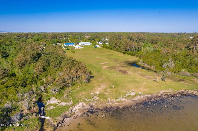 birds eye view of property with a wooded view