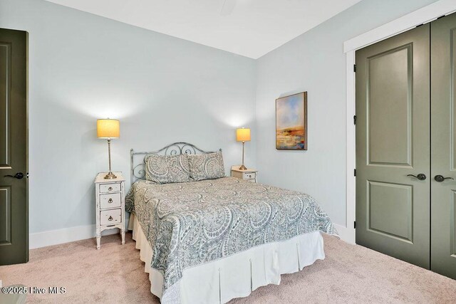 bedroom featuring light carpet