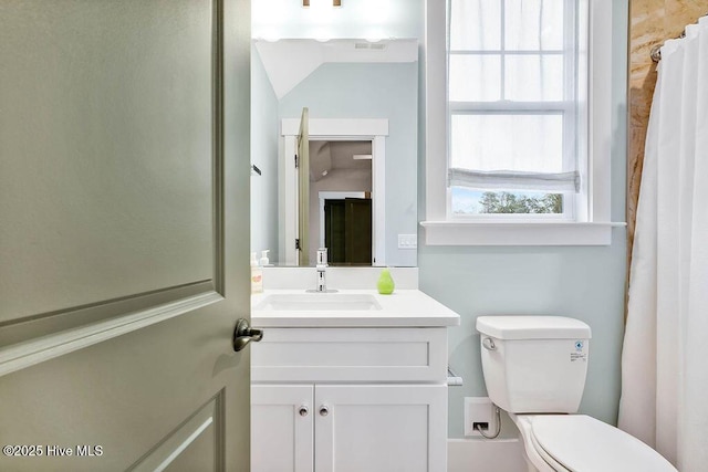 bathroom featuring vanity and toilet