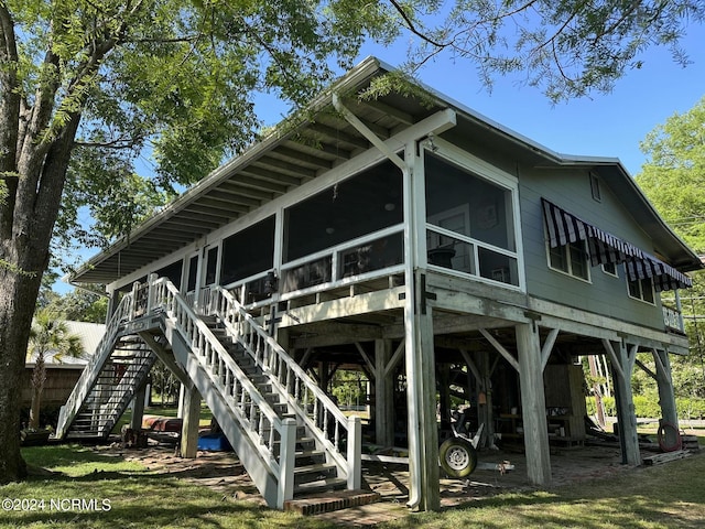 view of side of property featuring a sunroom