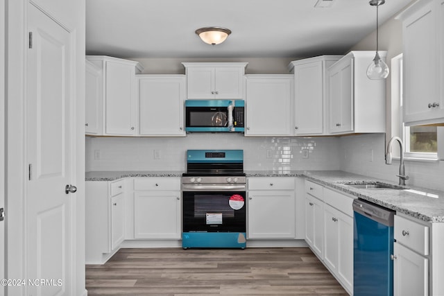 kitchen featuring white cabinetry, appliances with stainless steel finishes, and sink