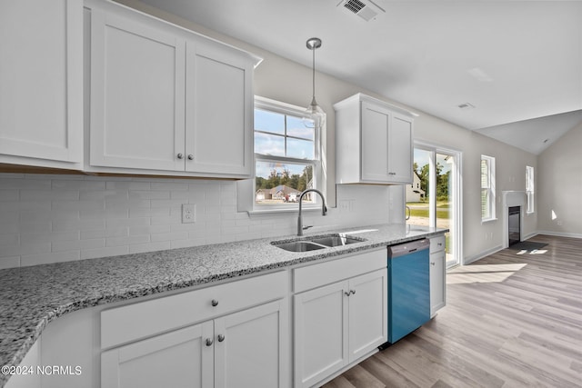 kitchen with white cabinets, dishwasher, light wood-type flooring, and sink