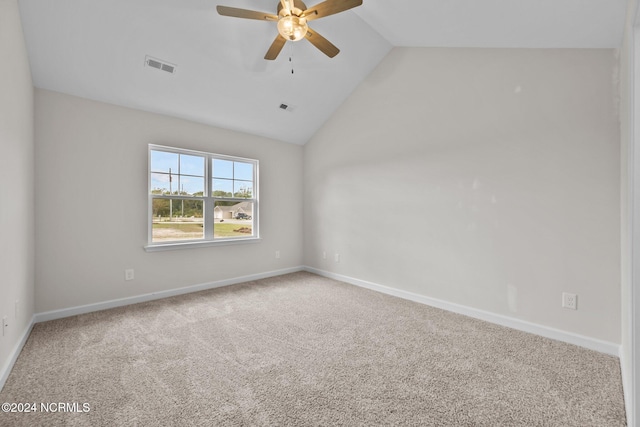 carpeted empty room featuring high vaulted ceiling and ceiling fan