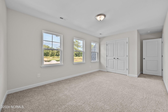 200 Slater Way, Jacksonville, NC 28540 - unfurnished bedroom featuring carpet, baseboards, and a closet