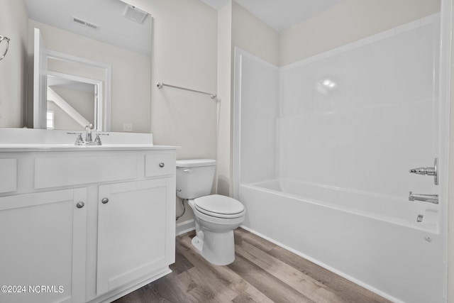 200 Slater Way, Jacksonville, NC 28540 - bathroom featuring wood finished floors, toilet, vanity,  shower combination, and baseboards