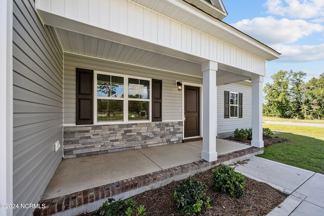 doorway to property with a porch