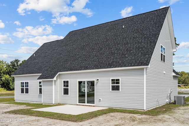 back of property with a patio and cooling unit