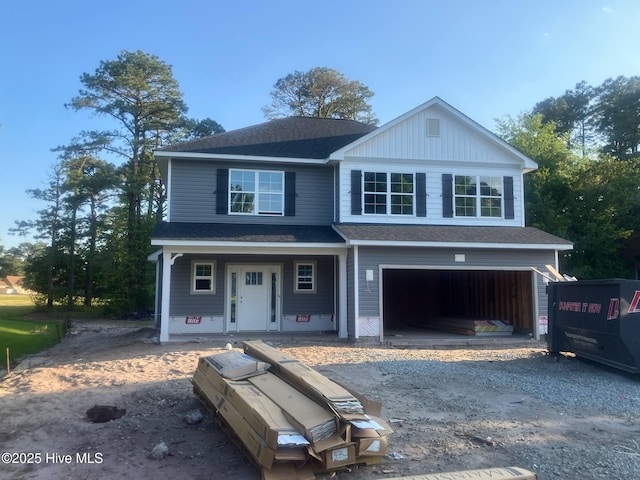 1430 Mona Passage Ct, New Bern, NC 28560 - view of front of property with an attached garage, a shingled roof, and a porch
