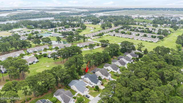 aerial view featuring a residential view, a water view, and golf course view