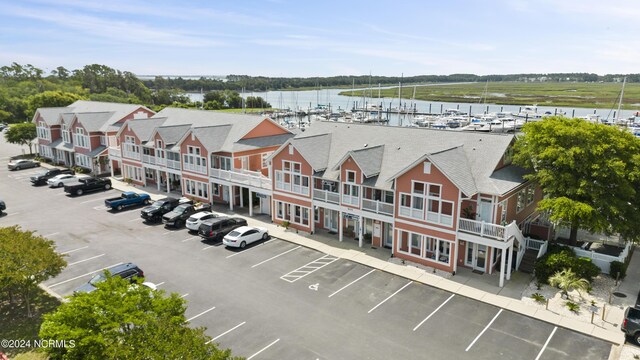 bird's eye view featuring a water view and a residential view