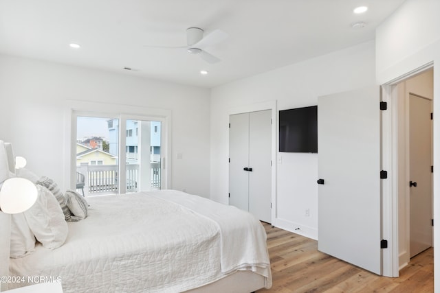 bedroom featuring ceiling fan, a closet, access to outside, and light hardwood / wood-style flooring