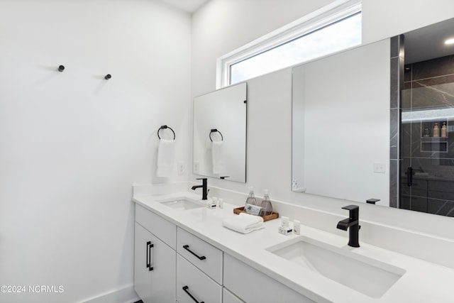 bathroom featuring vanity and an enclosed shower