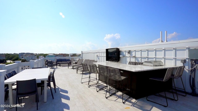 view of patio featuring an outdoor bar