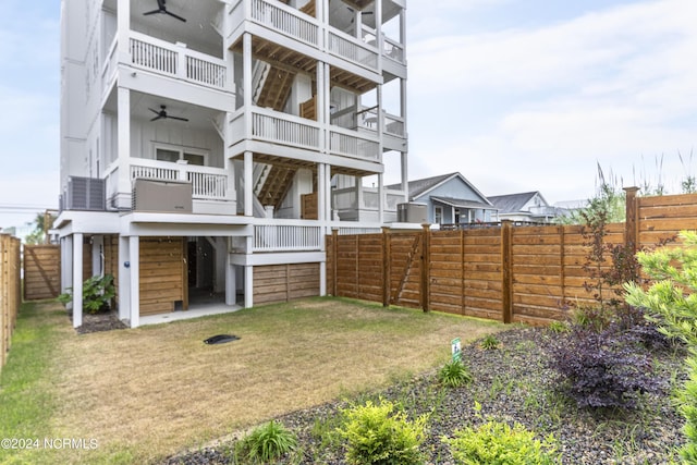 exterior space featuring ceiling fan, cooling unit, and a balcony