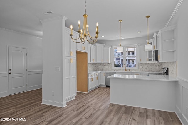 kitchen with white cabinetry, light hardwood / wood-style floors, tasteful backsplash, and pendant lighting