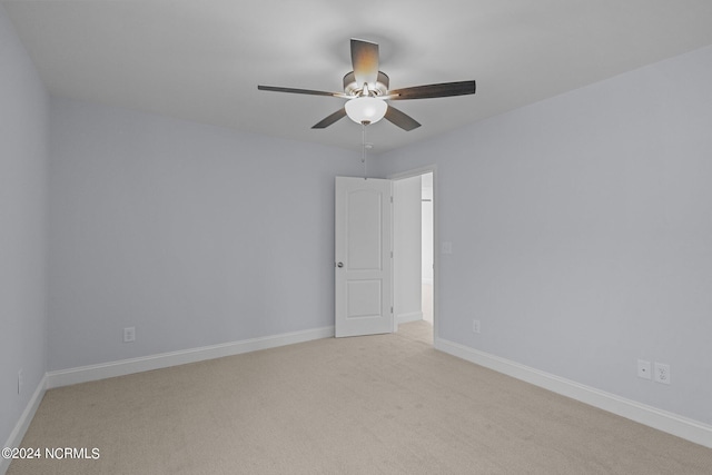 carpeted empty room with ceiling fan