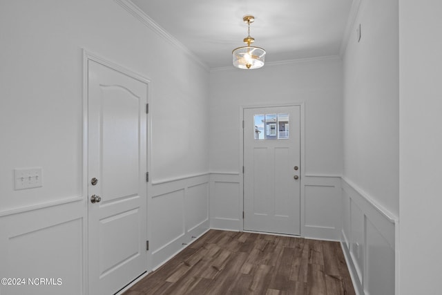 entrance foyer featuring crown molding and dark hardwood / wood-style flooring