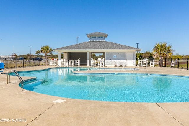 view of pool featuring a patio