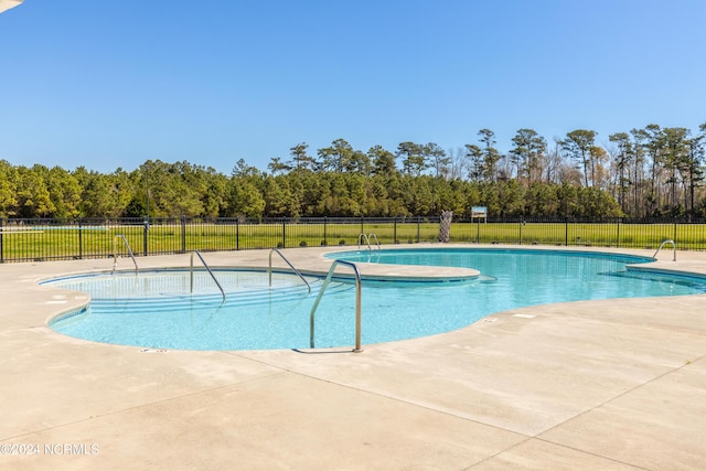 view of swimming pool featuring a patio area