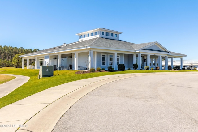 view of front of home with a front lawn and covered porch