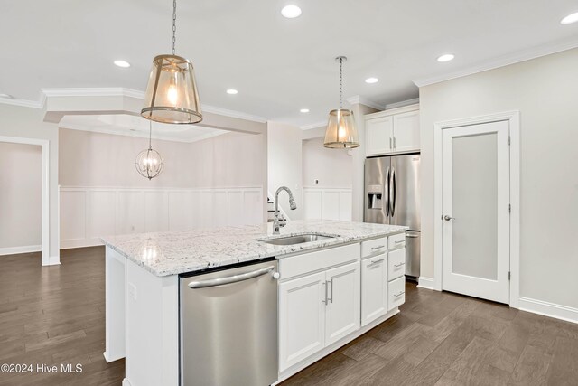 kitchen with light stone countertops, sink, appliances with stainless steel finishes, white cabinets, and ornamental molding