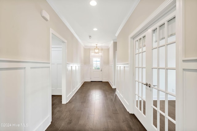 hall featuring dark hardwood / wood-style floors and crown molding