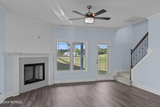 unfurnished living room with crown molding, dark hardwood / wood-style flooring, and ceiling fan