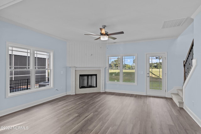 unfurnished living room featuring ceiling fan, light hardwood / wood-style floors, and crown molding