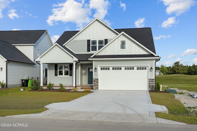 view of front of home featuring a front lawn and a garage