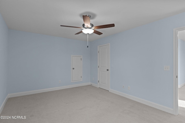 empty room with light carpet and ceiling fan