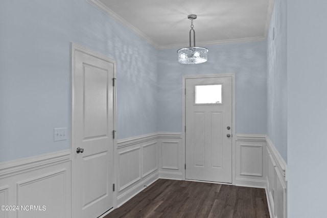 doorway to outside featuring dark hardwood / wood-style flooring, crown molding, and a chandelier