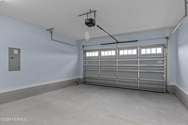 garage with electric panel and a garage door opener