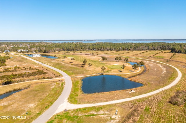 birds eye view of property featuring a water view and a rural view