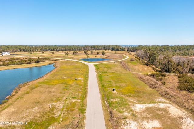 birds eye view of property with a water view and a rural view