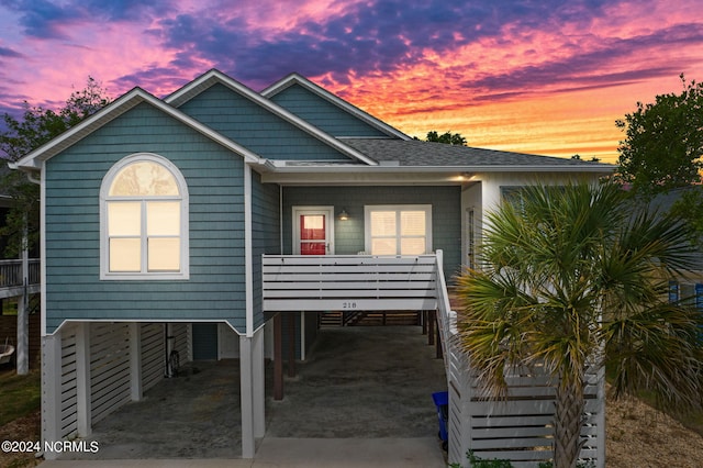 beach home featuring a carport