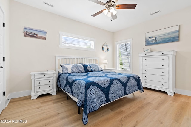 bedroom featuring light hardwood / wood-style flooring and ceiling fan